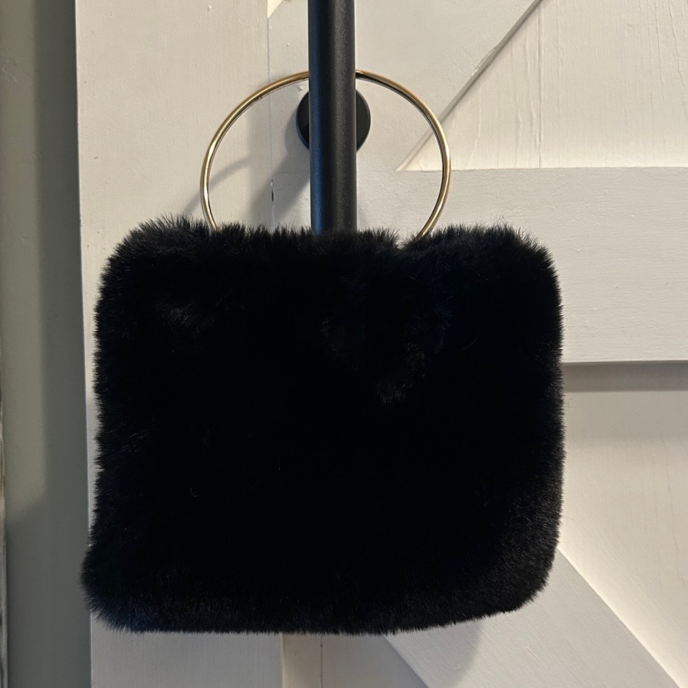 Elegant Black Faux Fur Clutch with ring handle.